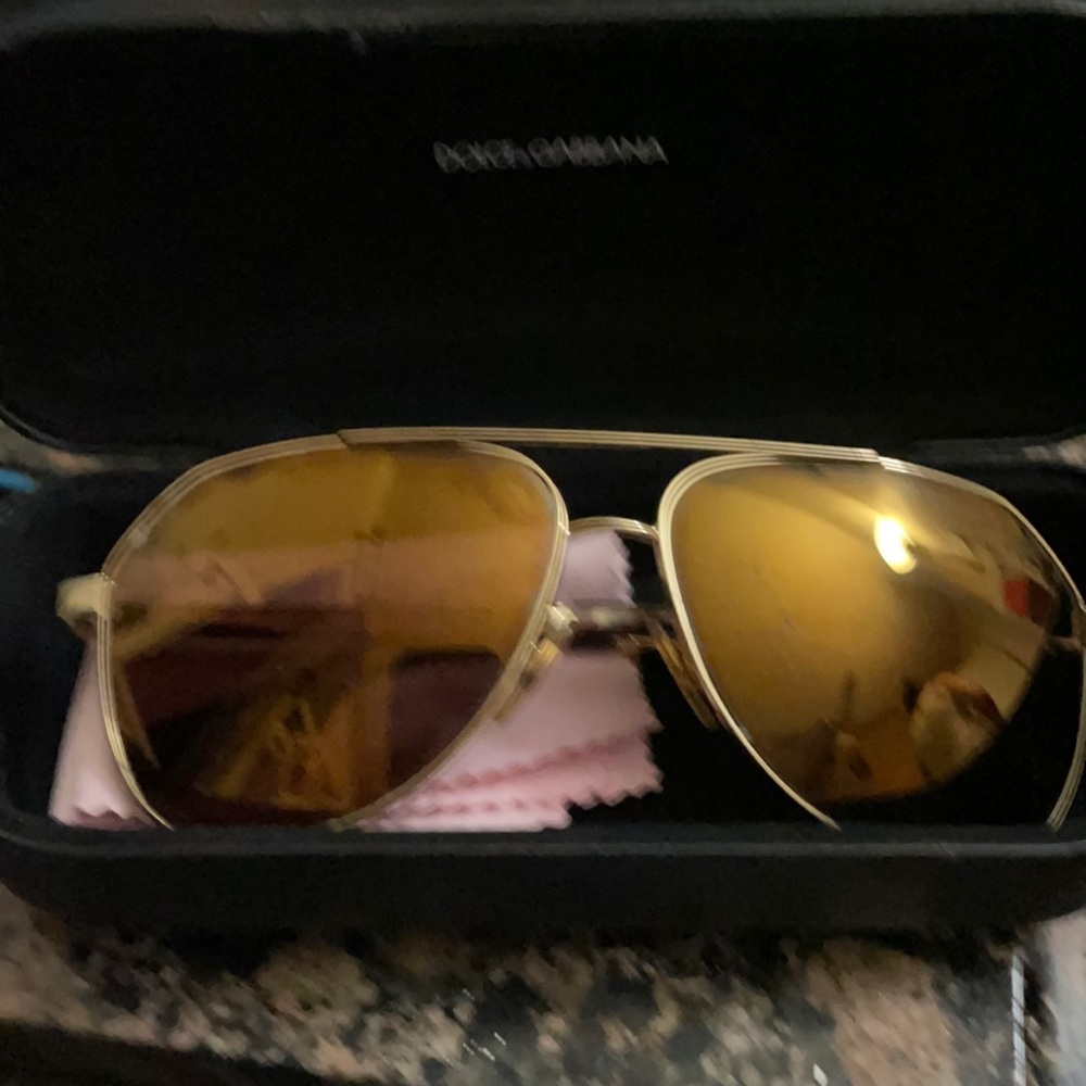 Dolce & Gabbana sunglasses and case.